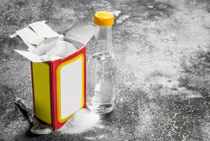 Baking Soda With Vinegar. On Rustic Background.