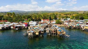 Fishing Village With Wooden Houses On Stilts In The Sea. Village