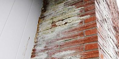 Efflorescence at brick chimney